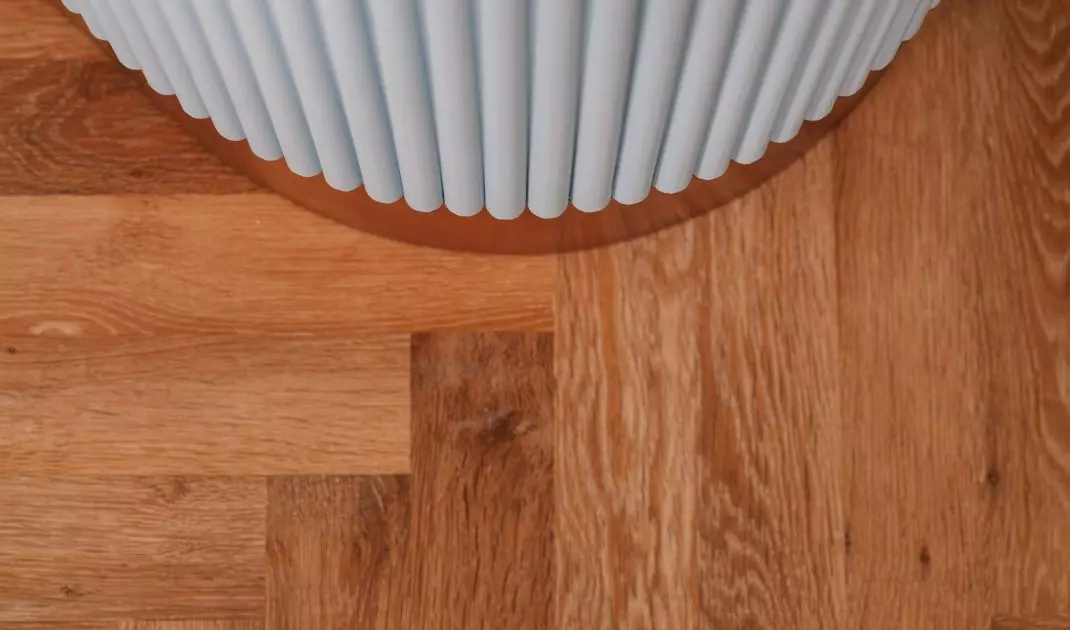 The kitchen peninsula has a fluted base