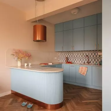 The bluish building was complemented with copper accessories