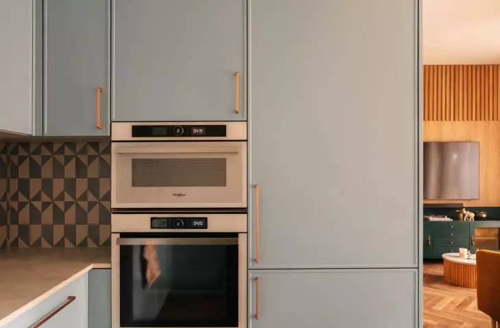 The blue of the development is the focal point of the kitchen design
