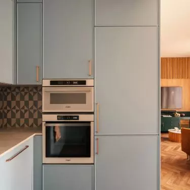 The blue of the development is the focal point of the kitchen design