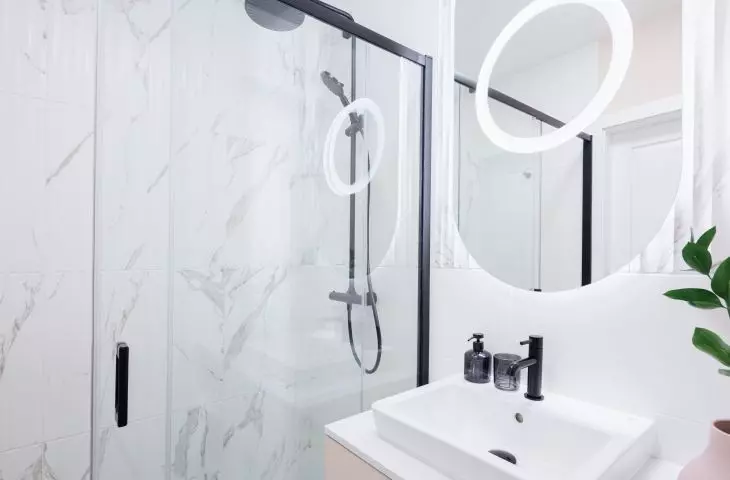 The walk-in shower has a minimalist form