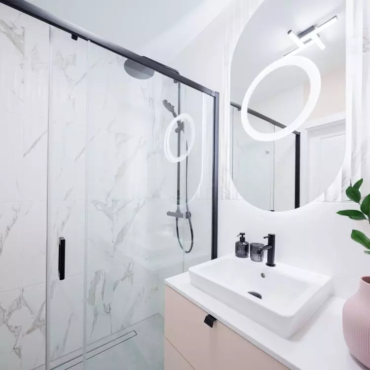 The walk-in shower has a minimalist form