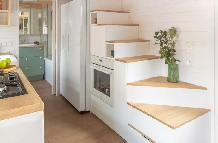 The staircase leading to the bedroom has also been used as a storage area