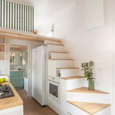 The staircase leading to the bedroom has also been used as a storage area