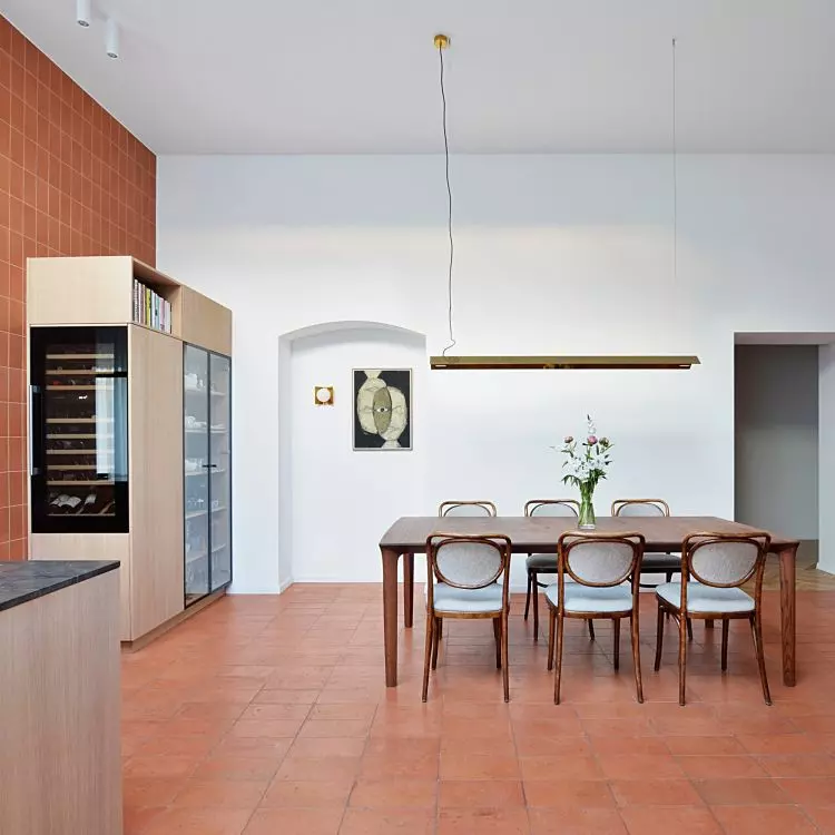 The kitchen is connected to the dining room