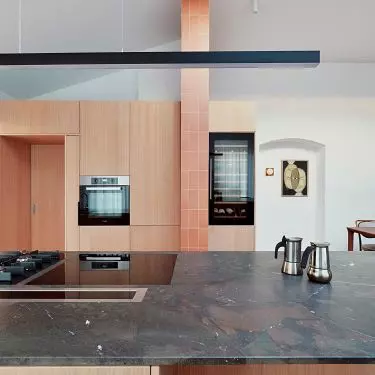 Cabinets hide the entrance to the pantry