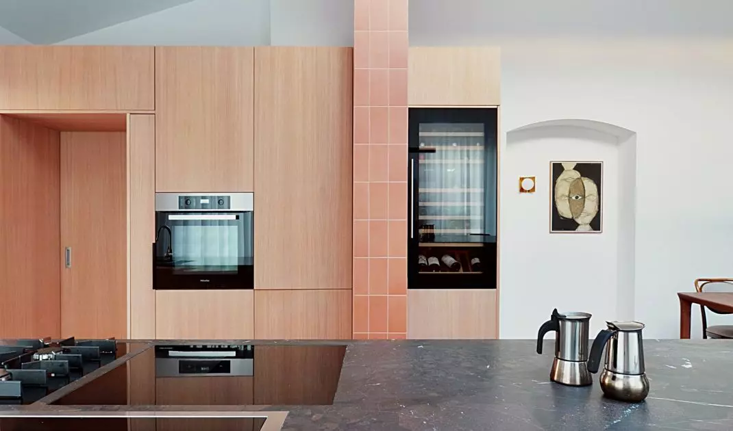 Cabinets hide the entrance to the pantry