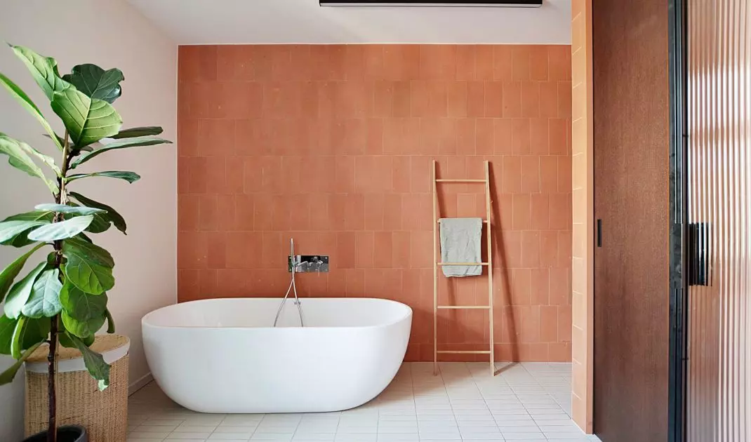 The bathroom uses stone