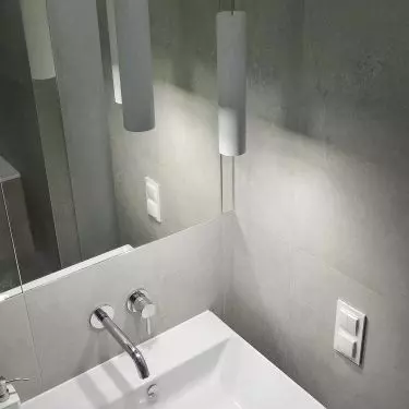 The lamps reflected in the mirror create an interesting visual effect