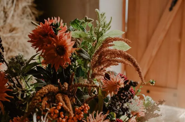 You can create an autumn flower composition, for example, in a basket, box or bucket