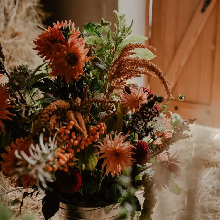 You can create an autumn flower composition, for example, in a basket, box or bucket