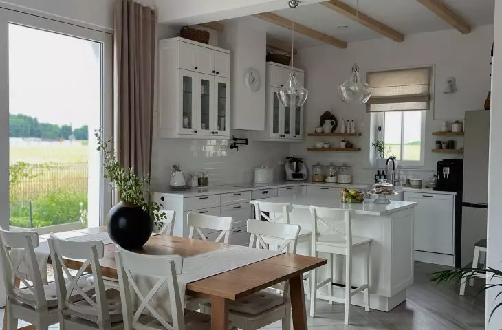 The dining chairs are consistent with those at the island