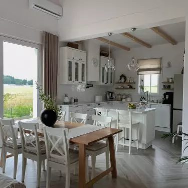 The dining chairs are consistent with those at the island