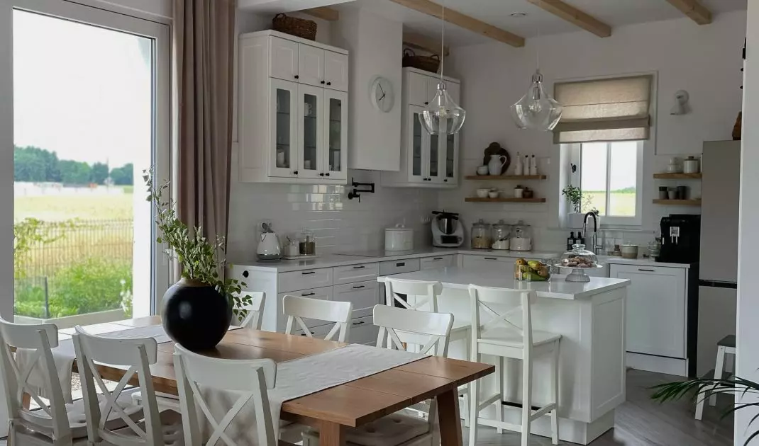 The dining chairs are consistent with those at the island