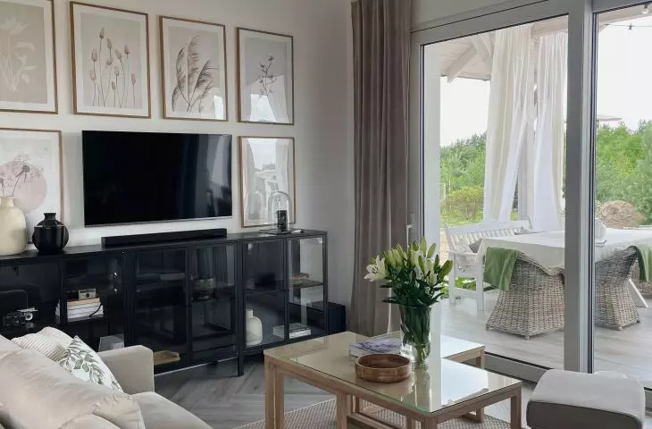 The TV screen is surrounded by images