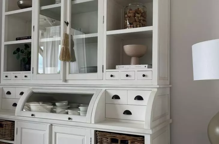 The lounge area features a vintage-style display case