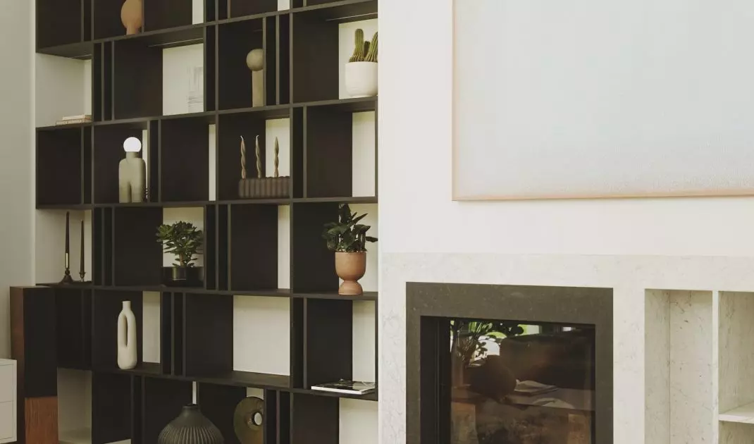 Black bookcase stands out against white wall