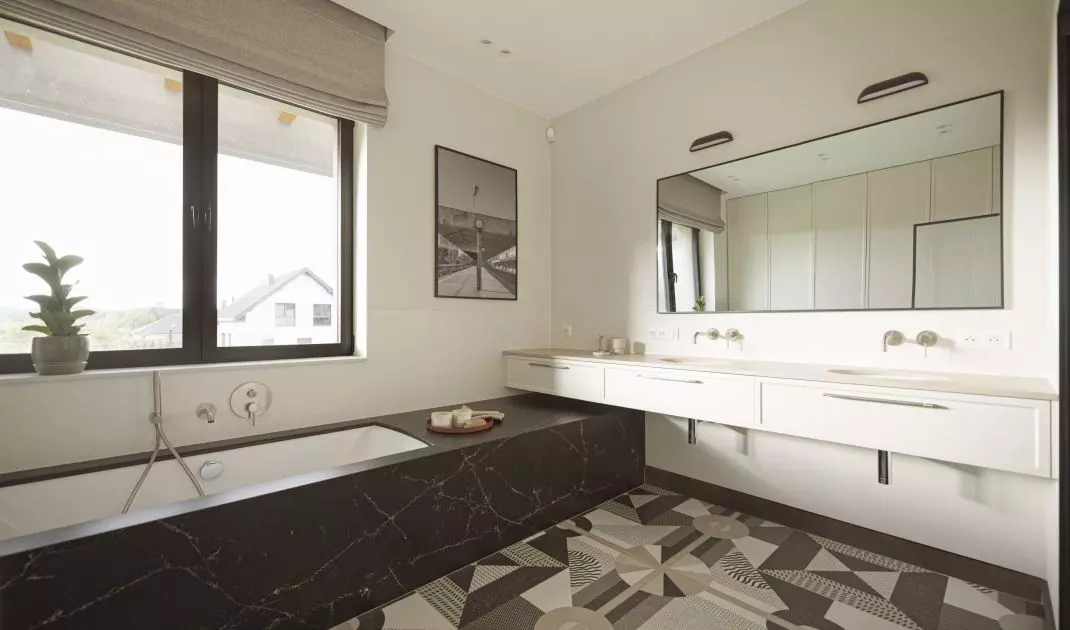 The bathroom floor was tiled in a geometric pattern