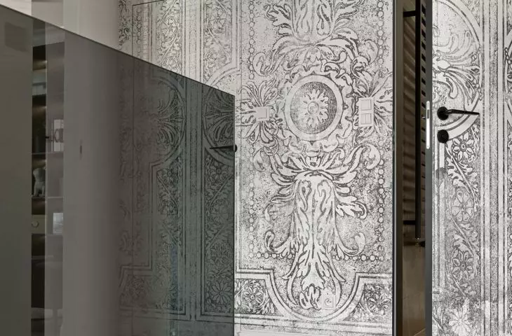 One of the walls in the hallway was covered with decorative wallpaper