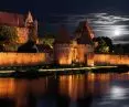 Illumination of the walls of Malbork Castle and the boulevard area on the Nogat River