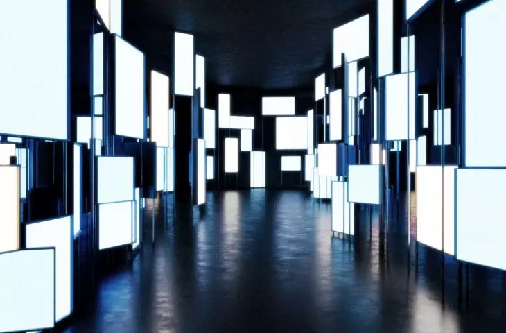 Corridor filled with screens