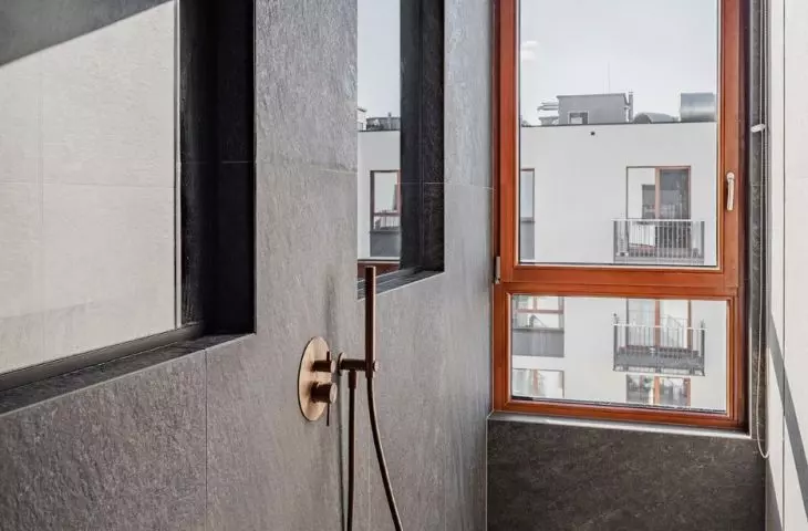 The shower area has a window