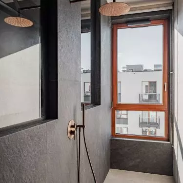 The shower area has a window