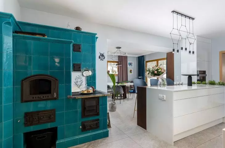 In the kitchen there is an azure stove 