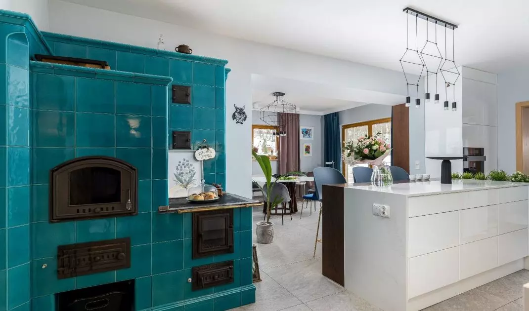 In the kitchen there is an azure stove 