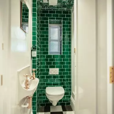 The low flush rack is about 80-90 cm high. Consider this model if you plan to install a toilet under a window