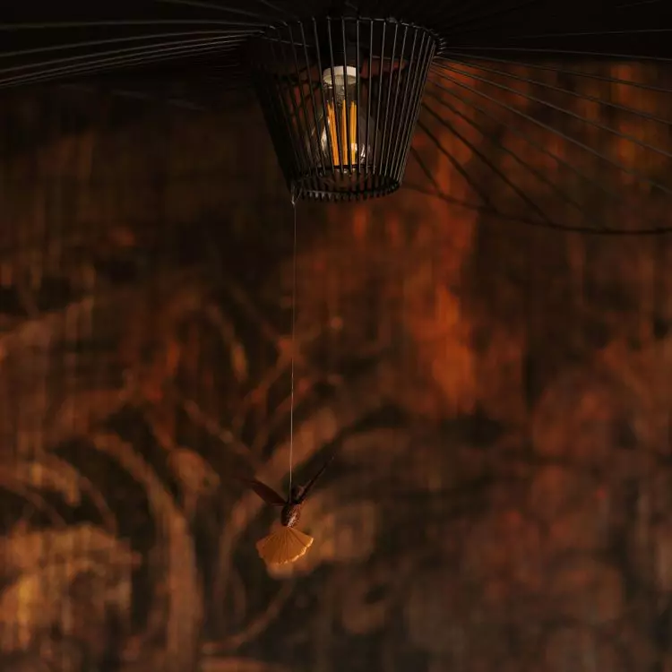 The hat-shaped lamp is complemented by a souvenir from the trip