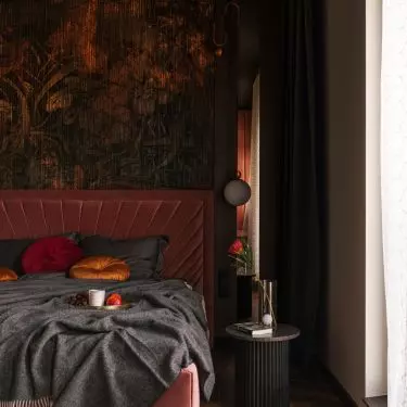Copper fronts correspond with the wallpaper behind the bed