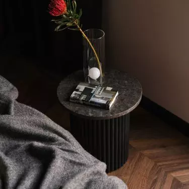 Tables with a fluted base were designed by Magdalena Wojtyczka