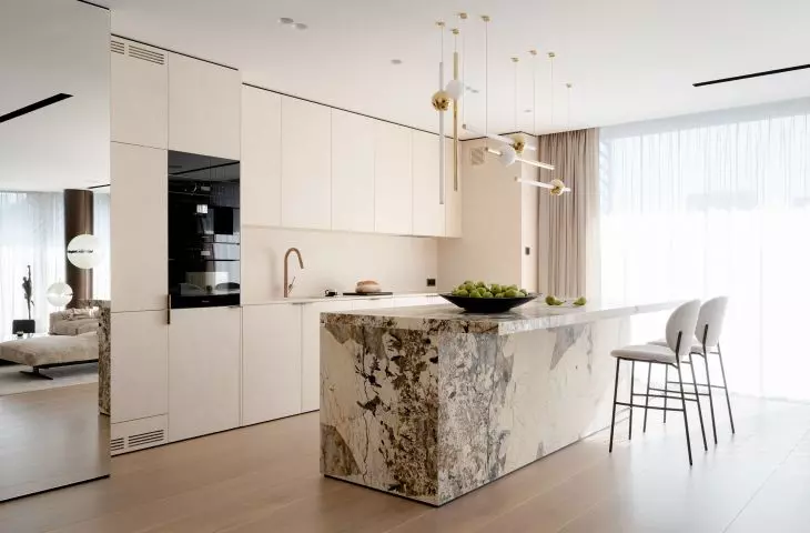 The kitchen island was covered with Brazilian quartzite