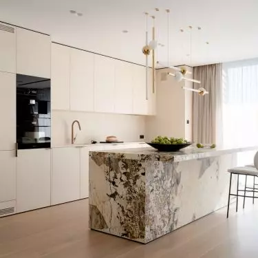 The kitchen island was covered with Brazilian quartzite