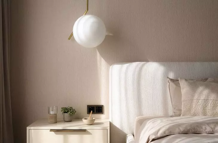 On the wall behind the bed is a cotton wallpaper