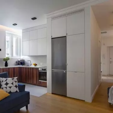 The fronts of the lower kitchen cabinets are made of rosewood