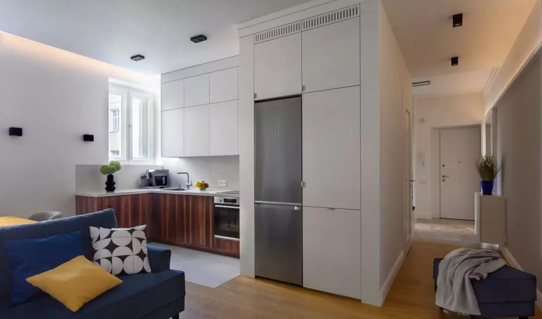 The fronts of the lower kitchen cabinets are made of rosewood