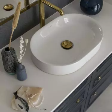 White countertops contrast with navy blue fronts