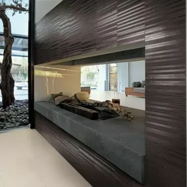A double-sided fireplace can help separate zones in a room