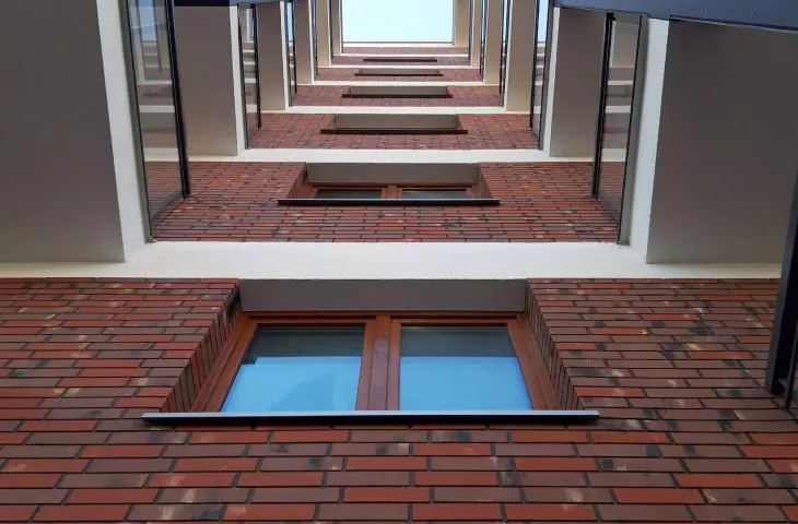 Przykład wykorzystania elastycznych płytek elewacyjncyh w systemie IZOFLEX (6124 BELGIUM)