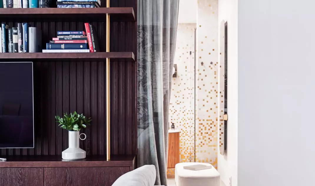 The same mosaic appears in the bathroom and on the structural column