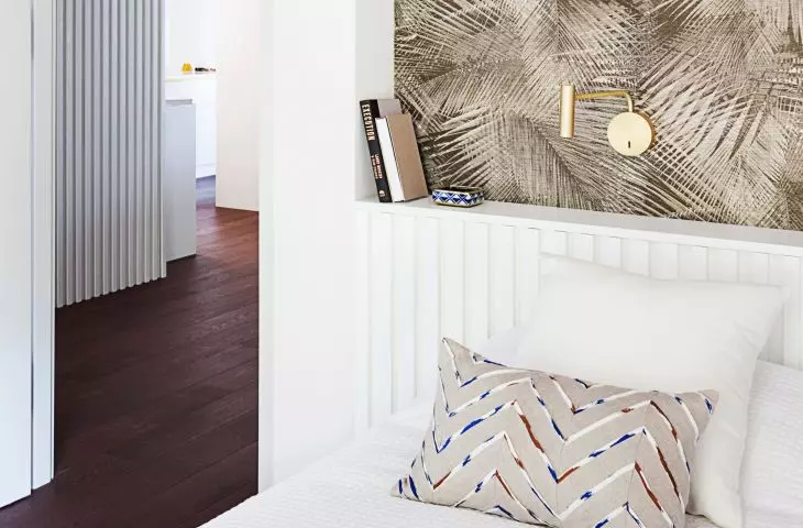 The headrest of one of the beds is decorated with millwork