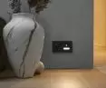 Lighting fixture with motion sensor and power socket (Simon 55 Line in matte black)