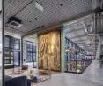 In Montownia in Gdansk, Heradesign panels on the ceiling complement the loft character of the interiors