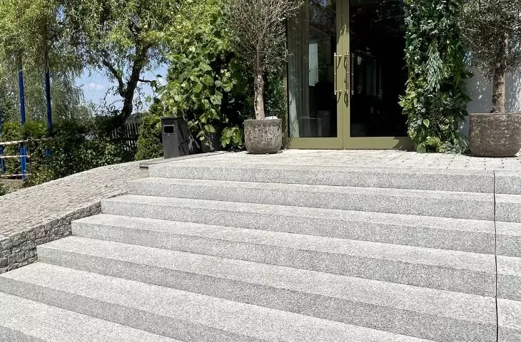 Entrance to the restaurant with granite block steps