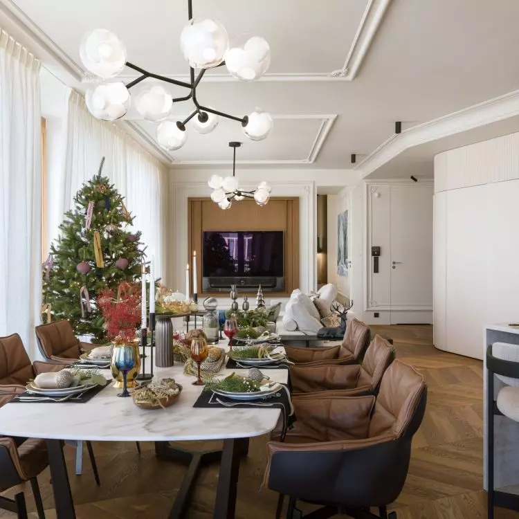 There are brown leather chairs at the large dining table