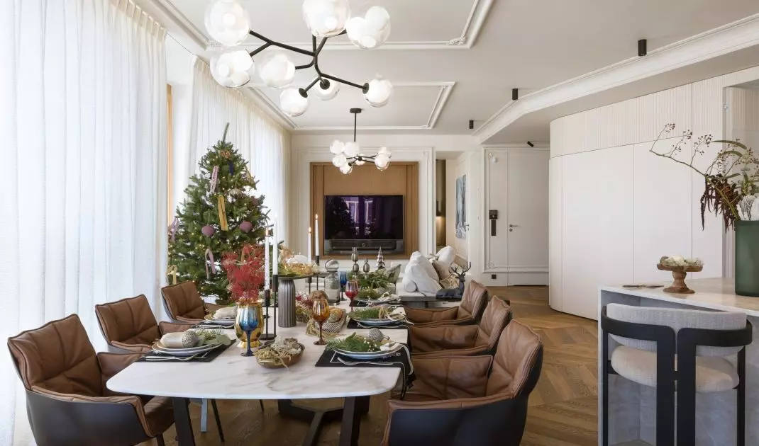 There are brown leather chairs at the large dining table