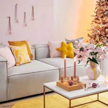 Don't want to hang baubles on your Christmas tree? Nail them to the wall!