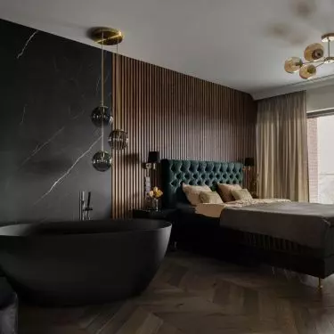 The bedroom has a freestanding bathtub